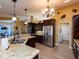 Modern kitchen with stainless steel appliances, granite counters, and ample cabinet space at 47 Sportsman Ln, Rotonda West, FL 33947