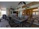 Covered patio with outdoor dining area, ceiling fans, and access to the living room at 47 Sportsman Ln, Rotonda West, FL 33947