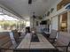 Covered patio with dining table, ceiling fan, and pool view at 47 Sportsman Ln, Rotonda West, FL 33947