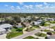 Aerial view of a residential neighborhood, showcasing well-maintained homes and lush landscaping at 560 Sandlor Dr, Englewood, FL 34223