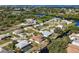 This property offers waterfront living with a private dock and a pool, set in a lush, tropical landscape at 560 Sandlor Dr, Englewood, FL 34223