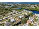 Aerial view of a waterfront home with a pool and private boat dock at 560 Sandlor Dr, Englewood, FL 34223