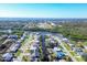 An aerial view showcasing a home nestled within a waterfront community at 560 Sandlor Dr, Englewood, FL 34223
