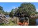 Picturesque backyard featuring a private dock and boat lift, perfect for enjoying waterfront living at 560 Sandlor Dr, Englewood, FL 34223