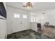 Inviting home foyer featuring a unique slate tile floor and natural light at 560 Sandlor Dr, Englewood, FL 34223