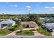 Charming single-story home with a well-manicured lawn and a two-car garage at 560 Sandlor Dr, Englewood, FL 34223