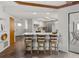 Kitchen with bar seating and an open concept design offering easy access to outside at 560 Sandlor Dr, Englewood, FL 34223