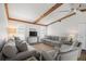 Bright living room featuring hardwood floors, neutral paint, and exposed wood beams at 560 Sandlor Dr, Englewood, FL 34223
