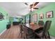 Dining area has a large wooden table with six chairs and leafy decor at 640 Floral Ln, Port Charlotte, FL 33952