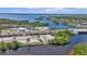 Aerial view showcasing the boat ramp, parking and waterway access at 7064 Baypine Ln, Englewood, FL 34224