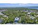 Birds-eye view of the home's location, including a view of the backyard pool and surrounding trees at 7064 Baypine Ln, Englewood, FL 34224
