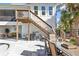 Outdoor space with pool, stairs leading to a deck, and a patio dining area at 7064 Baypine Ln, Englewood, FL 34224