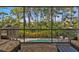 Screened balcony overlooking the pool and backyard at 7064 Baypine Ln, Englewood, FL 34224