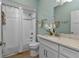 Bright, clean bathroom with white vanity, shower/tub combo, and modern fixtures at 7064 Baypine Ln, Englewood, FL 34224