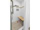 Modern bathroom with white tiled shower, built-in bench, and hexagonal floor tiles at 7064 Baypine Ln, Englewood, FL 34224