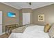 Comfortable bedroom with king bed, wood accent wall, and relaxing coastal theme at 7064 Baypine Ln, Englewood, FL 34224