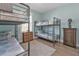Bunk room with two sets of twin-over-twin bunk beds and light blue walls at 7064 Baypine Ln, Englewood, FL 34224