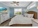 Coastal-themed bedroom with a large bed and a TV at 7064 Baypine Ln, Englewood, FL 34224
