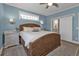 Bedroom with light blue walls and sliding barn door at 7064 Baypine Ln, Englewood, FL 34224