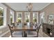 A bright dining room featuring a wood table and large windows at 7064 Baypine Ln, Englewood, FL 34224