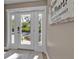 Bright and welcoming foyer entryway with a view to the front yard at 7064 Baypine Ln, Englewood, FL 34224