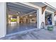 Garage interior with cabinets, storage, and a car lift at 7064 Baypine Ln, Englewood, FL 34224