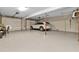 Spacious two-car garage with epoxy floor and storage space at 7064 Baypine Ln, Englewood, FL 34224