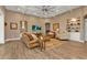 Coastal living room with built-in shelving, decorative accents, and ample space at 7064 Baypine Ln, Englewood, FL 34224