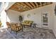 Covered patio with seating area and access to the pool at 7064 Baypine Ln, Englewood, FL 34224