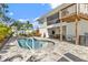 Backyard oasis with a pool, patio, and elevated deck at 7064 Baypine Ln, Englewood, FL 34224