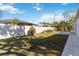 Backyard with grassy area and privacy fence at 792 Lehigh Rd, Venice, FL 34293