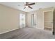 Bedroom with carpet, ceiling fan and access to bathroom at 792 Lehigh Rd, Venice, FL 34293