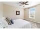 Bright bedroom with carpeted floor, ceiling fan, and window with blinds at 792 Lehigh Rd, Venice, FL 34293