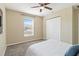 Comfortable bedroom with carpet, ceiling fan, a closet and natural light from the window at 792 Lehigh Rd, Venice, FL 34293