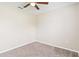 Neutrally decorated bedroom with plush carpet, ceiling fan and ample space at 792 Lehigh Rd, Venice, FL 34293