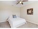Neutral bedroom with soft carpet and a ceiling fan, creating a cozy and calm retreat at 792 Lehigh Rd, Venice, FL 34293