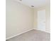 Empty bedroom with neutral walls and carpeted floor at 792 Lehigh Rd, Venice, FL 34293