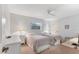 Bedroom with two twin beds, white furniture, and neutral walls at 9131 Berendo Ave, Englewood, FL 34224
