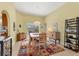Dining area with stylish wood furniture and backyard pool views at 9131 Berendo Ave, Englewood, FL 34224