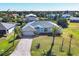 Charming blue home with landscaped yard and attached two-car garage at 9131 Berendo Ave, Englewood, FL 34224