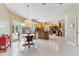 Bright open-concept kitchen and dining area with tile floors and view of patio at 9131 Berendo Ave, Englewood, FL 34224