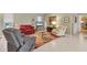Living room with comfortable seating, a large area rug, and tile floors at 9131 Berendo Ave, Englewood, FL 34224