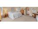 Large main bedroom with carpeted floors, king-size bed, and attached bathroom at 9131 Berendo Ave, Englewood, FL 34224