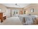 Spacious main bedroom featuring carpet, a king-size bed, and French doors to a balcony at 9131 Berendo Ave, Englewood, FL 34224