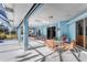Covered patio with seating area overlooking the pool at 9131 Berendo Ave, Englewood, FL 34224