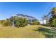Private pool enclosure with lush landscaping and a storage shed at 9131 Berendo Ave, Englewood, FL 34224