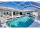 Screened-in pool with patio, grill, and view of the house at 9131 Berendo Ave, Englewood, FL 34224