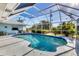 Large pool with a screen enclosure and surrounding patio at 9131 Berendo Ave, Englewood, FL 34224