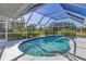 Pool with steps, screen enclosure, and lush greenery at 9131 Berendo Ave, Englewood, FL 34224