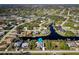 Stunning aerial view of a waterfront home in a serene canal-front community at 9300 Miami Cir, Port Charlotte, FL 33981